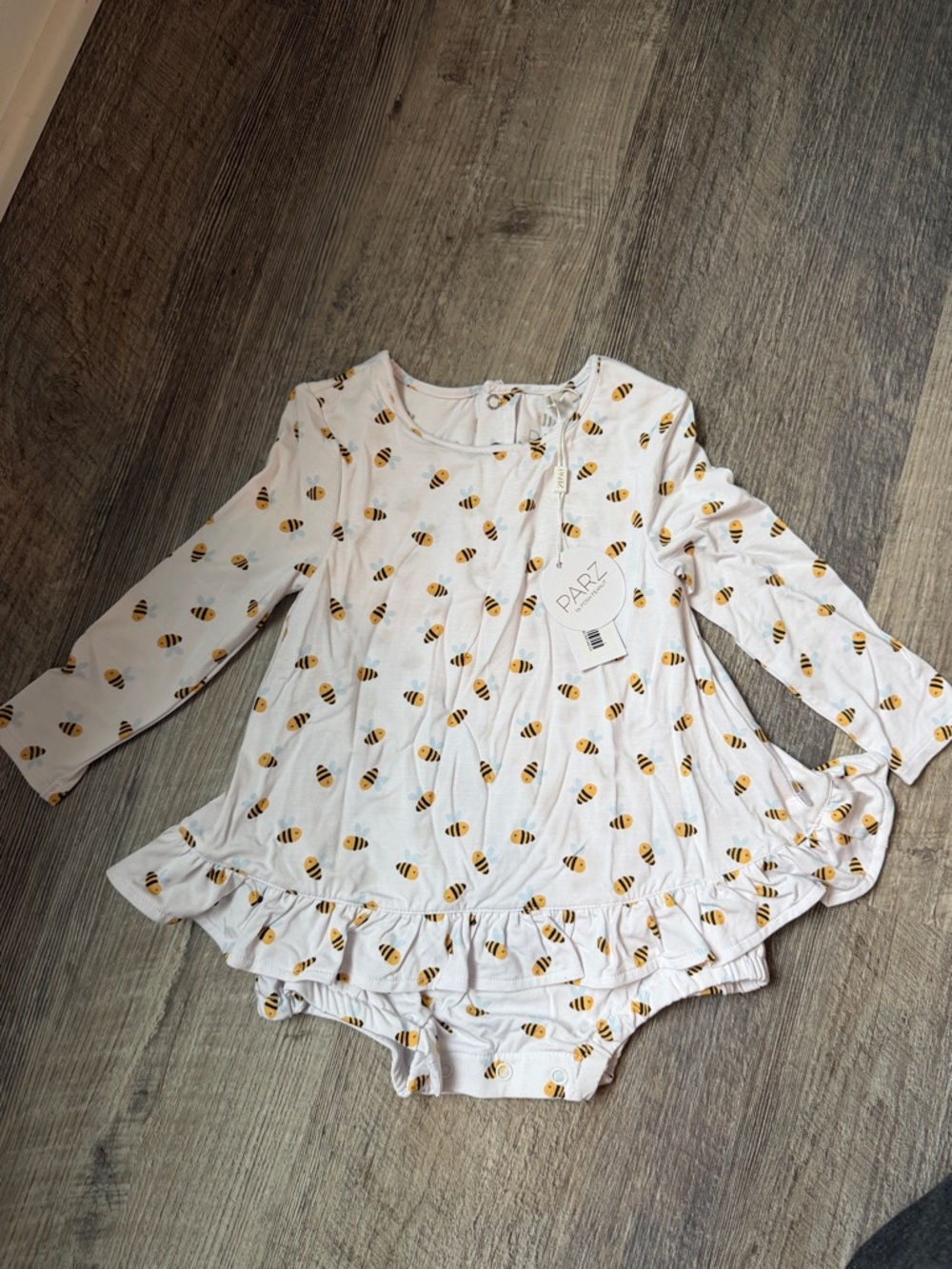 Posh Peanut White Bee Print Long Sleeve Ruffle One-Piece
